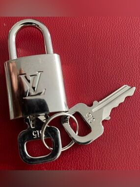 Louis Vuitton Silver Padlock and Keys on Red